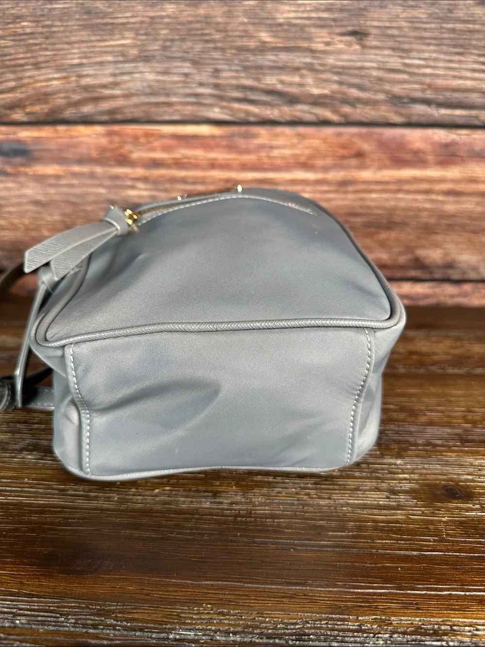 kate spade gray mini Bradley backpack with gold hardware